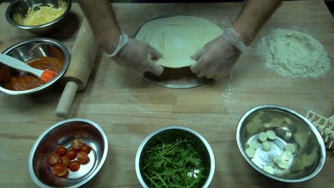 Pizza-cooking-time-lapse-on-wooden-table