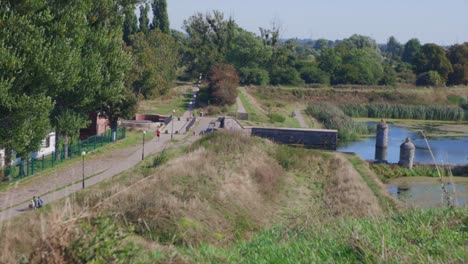 Jogging-people-on-path-beside-river-in-Gdansk