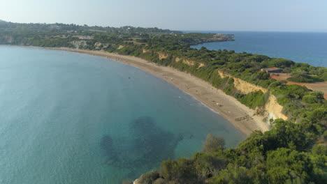 Idyllic-Greek-Mediterranean-Zakynthos-island-aerial-view-above-turquoise-coastline-trees-landscape