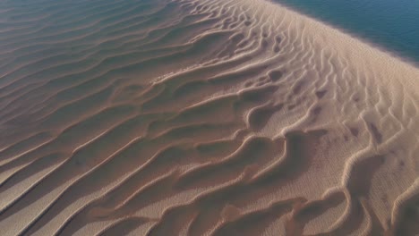 Beautiful-sand-patterns-by-the-sea--Aerial