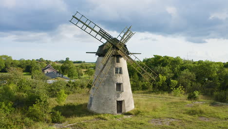 Aerial-shot-of-an-old-windmill-made-of-stone-and-wood