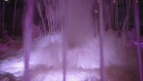 Footage-of-water-fountain-with-the-purple-splash-during-Christmas-holiday