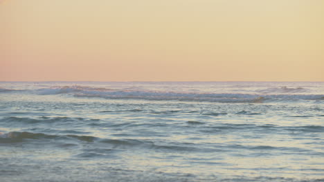 Peaceful-scene-of-ocean-waves-at-sunset.-Static