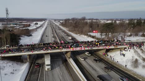 Wide-aerial-shot-of-the-crowd-on-the-Victoria-Bridge-located-in-Vineland,-Ontario