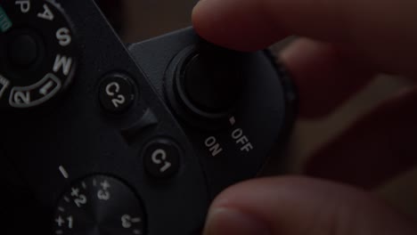 Close-up,-person's-hand-switching-on-a-Sony-camera