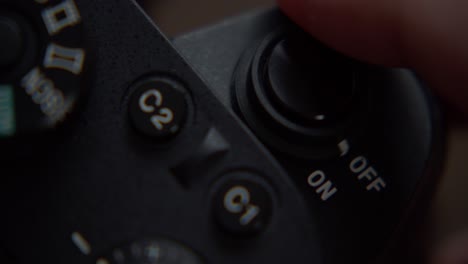 closeup-switch-on-camera-button-shutter-settings-equipment-photography-gear