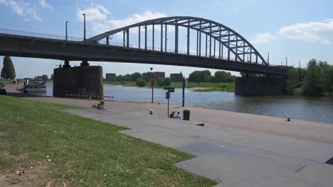 Arnhem-Netherlands-Bridge-World-War-two-Site-with-cars-driving-and-river