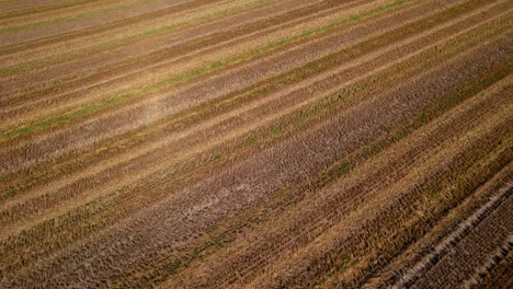 Aerial-flying-over-freshly-plowed-farm-field-ready-for-farming