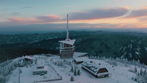 Lysa-hora-during-winter-sunrise,-Orbiting-around-the-transmitter,-Beskydy-UHD