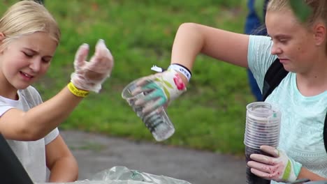 Young-girls-recycling-cups-at-festival
