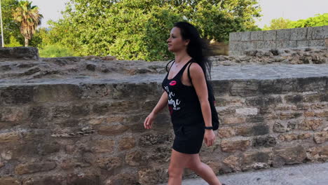 Woman-walking-through-the-streets-of-a-medieval-village