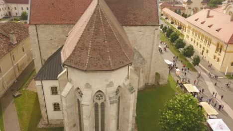 Aerial-Tracking-shot-of-Christian-Orthodox-Church-Showing-the-roof-and-the-back-of-the-church-in-Alba-Iulia-of-Citadel-Alba-Carolina-,-Romania
