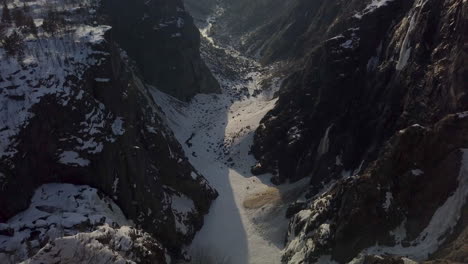 Epic-Drone-Tilt-Up-Shot-Revealing-a-Massive-Canyon-at-Voringfossen-in-Norway