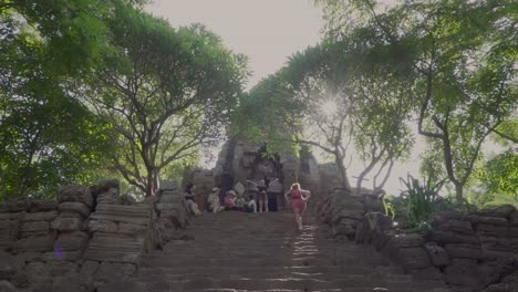 A-group-of-young-tourists-explore-an-ancient-Khmer-temple