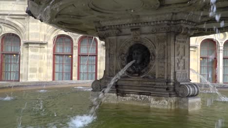 Close-up-left-pan-over-Water-fountain-in-front-of-Opera-in-Vienna