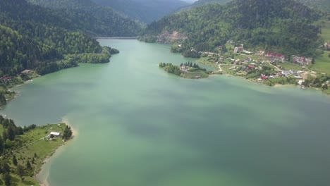 Aerial-panning-shot-lake---reservoir-water-in-valley