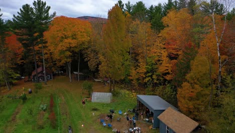 Aerial-flyover-of-backyard-family-gathering-in-autumn