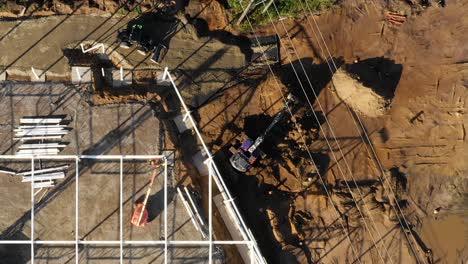 Birds-eye-view-of-construction-site.-Excavator-working
