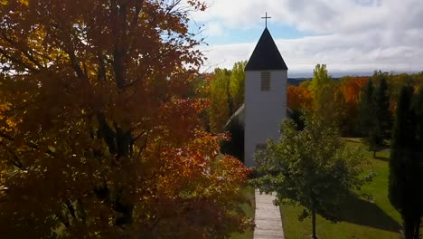 Panning-view-of-church-in-autumn