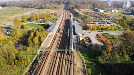 Aerial-view-of-train-station-with-train-departing