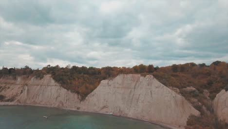 Aerial-clip-of-the-Scarborough-Bluffs-rock-cliffs-during-autumn,-in-Lake-Ontario,-Canada
