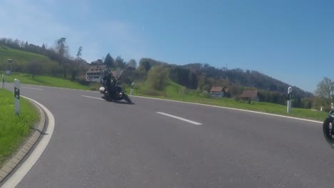 Collision-between-two-oncoming-motorcycles-on-a-winding-country-road-near-Zurich,-Switzerland