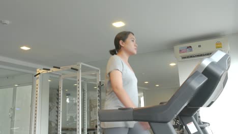 Asian-Woman-Fitness-Asian-Woman-working-out-on-Various-Fitness-Equipment-Fitness-Equipment