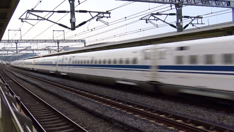 The-view-of-the-train-station-with-passing-shinkansen-bullet-train