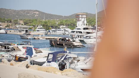 Motorboat-passing-by-at-Puerto-Portals-yachts-marina-in-Palma-de-Mallorca