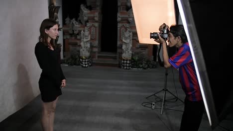 Slow-motion-scene-in-Balinese-photo-studio-having-passport-photograph-taken-by-male-photographer