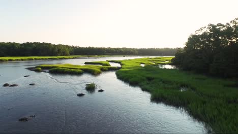 Low-flying-drone-over-waterway-in-Calabash-NC-at-sunrise
