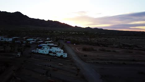Drone-Dolly-forwards,-showing-the-Glamis-North-Campground-in-the-California-Desert