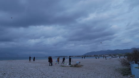 People-flying-a-kite-on-Patras-beach-with-bad-weather