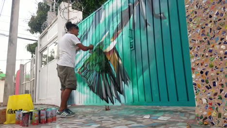 Graffiti-Artist-Eldakpak-Painting-A-Fence-In-Downtown-Mexico-2