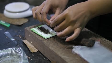 Close-up-panning-shot-across-traditional-Javanese-cigarette-rolling-handmade