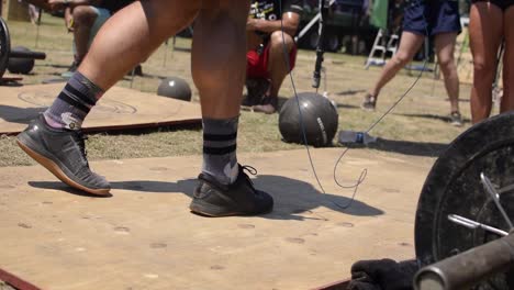 A-muscular-white-athletic-male-skips-rope-during-a-cross-fit-competition,-skipping-rope,-cardio-vascular-workout-and-popular-with-martial-artists,-boxers-and-cross-fitters