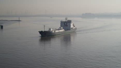 Aerial-view-of-a-cargo-ship-on-the-River-Thames,-Kent---Essex-England