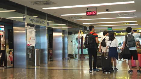 Singapore---Circa-Pullback-time-lapse-revealing-many-people-moving-about-during-day-at-airport