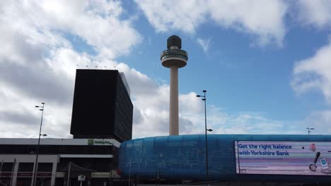 Panning-shot-across-Liverpool-city-skyline,-tracking-the-Radio-city-tower-on-the-sunny-horizon