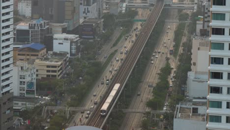 Single-Train-BTS-Skytrain-arriving-on-the-tracks-to-his-station
