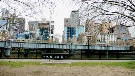 Melbourne-tourists-walking-yarra-riverside-walking-Queens-Bridge-in-daytime