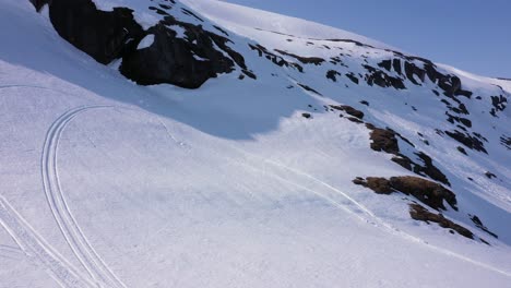 Aerial-view-over-snowy-mountain-landscape