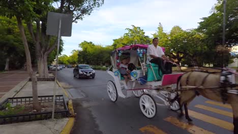 the-calandria-or-tumbril-ride-on-Montejo-avenue-in-Merida,-takes-us-back-to-the-colonial-era