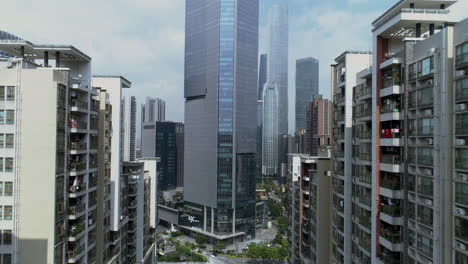 Aerial-shot-of-Guangzhou-downtown-living-block-with-numerous-office-buildings-in-the-background-on-a-sunny-day-in-the-afternoon,-Guangdong,-China