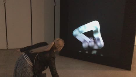 AI-Robot-on-screen-follows-human-moves-at-the-'AI:-More-than-Human'-exhibition,-Barbican