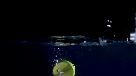 high-fps-slow-motion-reverse-video-of-a-lime-slice-splashing-into-the-water