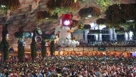 4K-UHD-timelapse-Cinemagraph-of-the-famous-beer-tent-Hofbräu-on-the-world-famous-Munich-Oktoberfest---Wiesn-with-a-seamless---endless-loop-of-Aloisius-turning-above-the-dancing-crowd