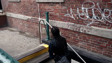 Young-attractive-couple-enters-nyc-subway-station-in-Brooklyn