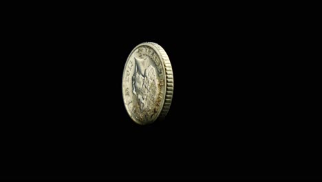 A-british-coin-turns-slowly-on-its-edge-with-the-queens-head-upside-down