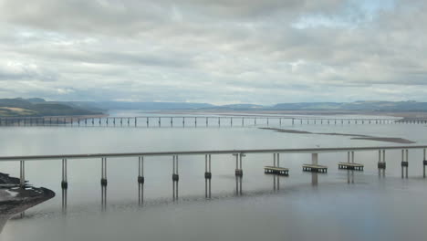 An-aerial-view-of-the-Tay-Road-bridge-with-the-rail-bridge-in-the-background-on-a-cloudy-day
